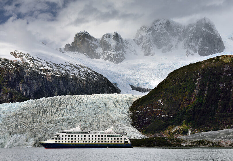 Sail close up to awe-inspiring glaciers as they crash into the sea