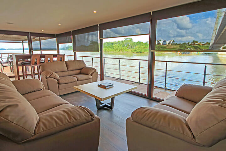 The lounge on the Anakonda with lovely views of the rainforest
