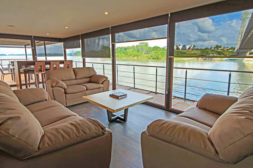 The lounge on the Anakonda with lovely views of the rainforest