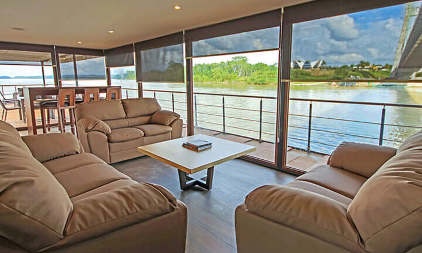 The lounge on the Anakonda with lovely views of the rainforest