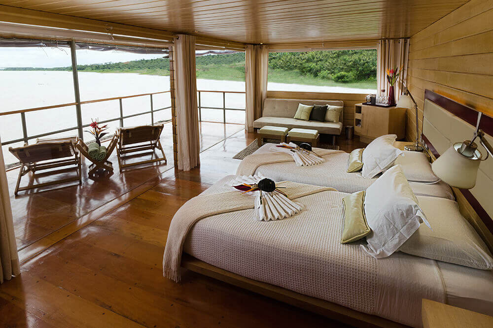 The master suite has expansive views of the jungle