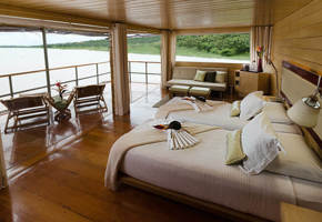 The master suite has expansive views of the jungle