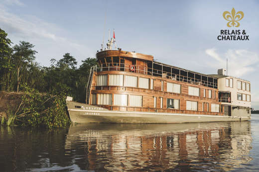 The Delfin II luxury riverboat cruising through the Amazon rainforest from Iquitos, Peru. 
