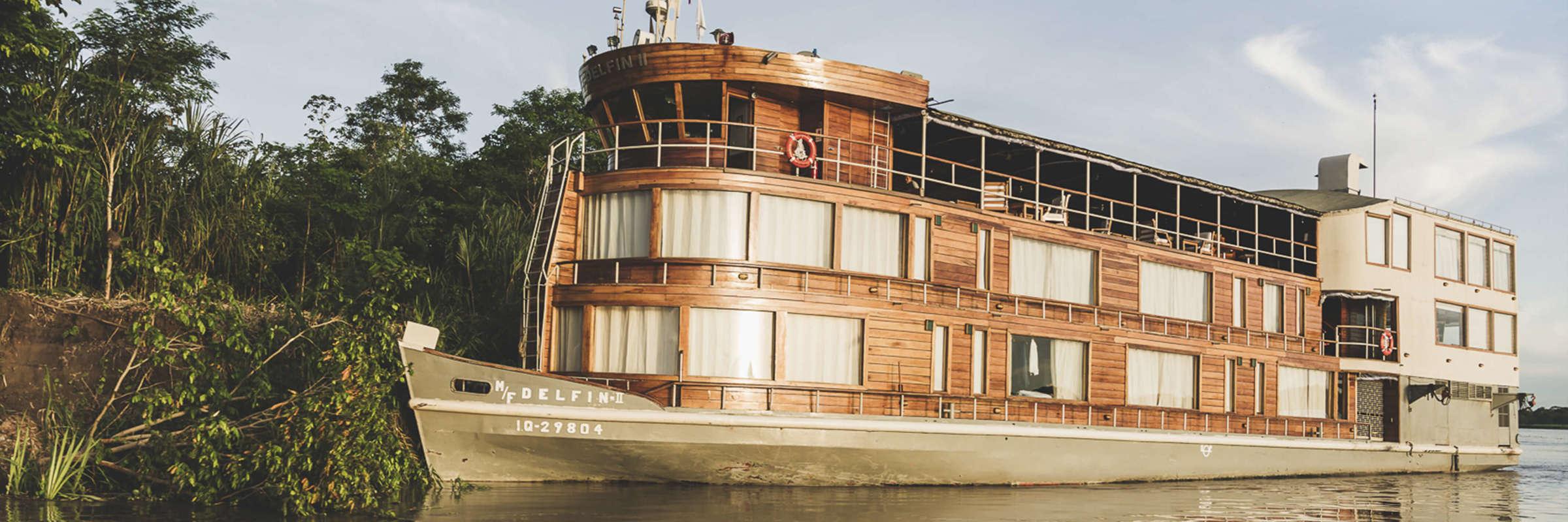 The Delfin II luxury riverboat cruising through the Amazon rainforest from Iquitos, Peru. 
