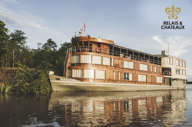 The Delfin II luxury riverboat cruising through the Amazon rainforest from Iquitos, Peru. 