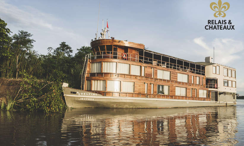 The Delfin II luxury riverboat cruising through the Amazon rainforest from Iquitos, Peru. 