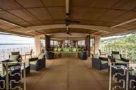 Relax in style on the spacious sun deck of the Pacaya Cruise, surrounded by Amazon rainforest views. 