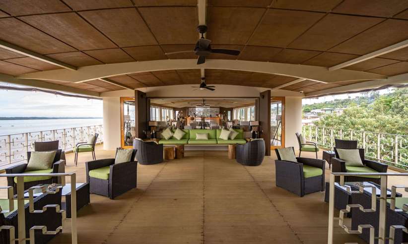 Relax in style on the spacious sun deck of the Pacaya Cruise, surrounded by Amazon rainforest views. 