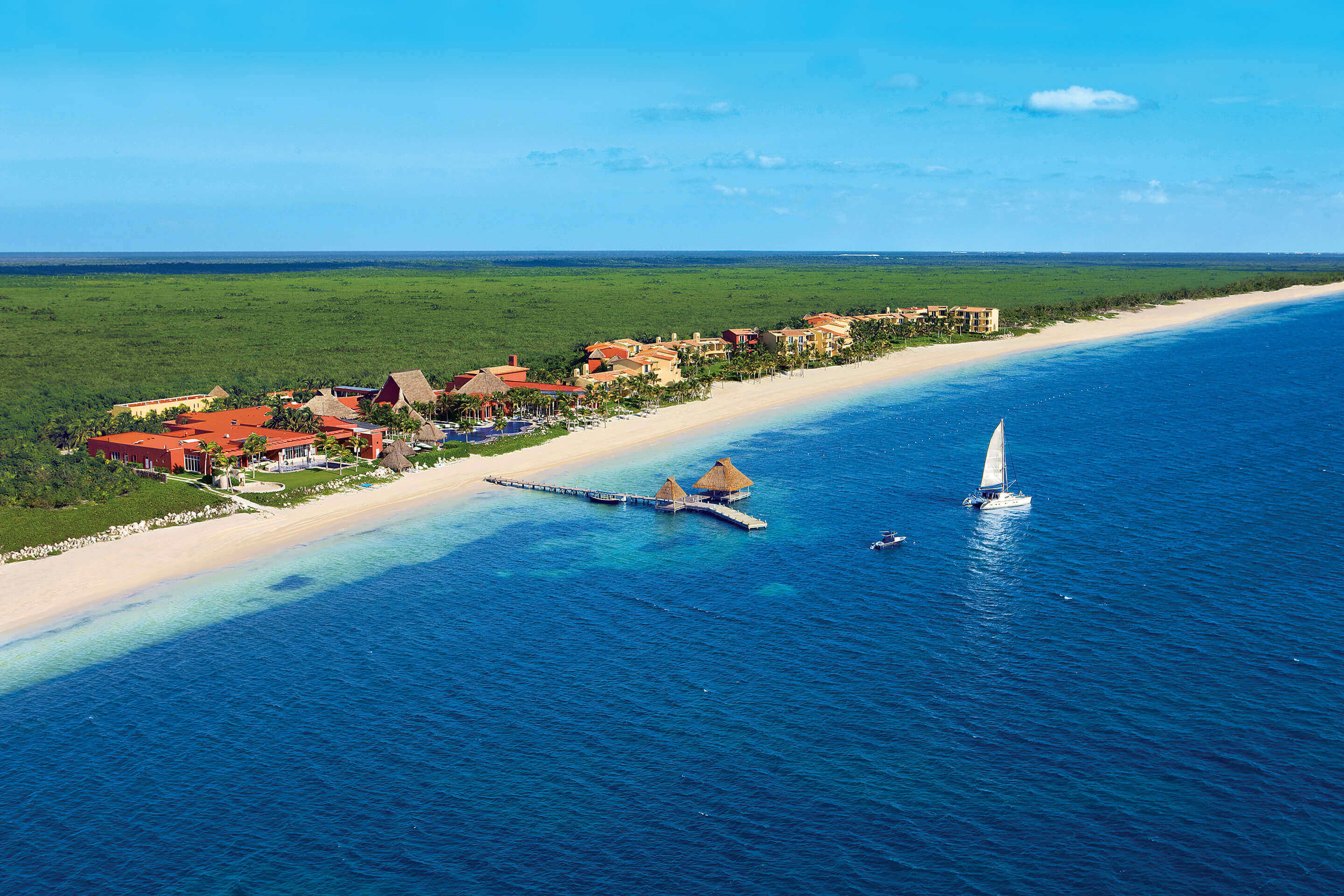 Aerial view of Zoetry Paraiso de la Bonita Resort on the Yucatan coast, with white sand beach and turquoise Caribbean Sea. 