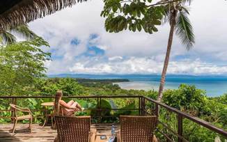 A peaceful retreat at Lapa Rios overlooks the lush Osa rainforest and sparkling Pacific horizon. 