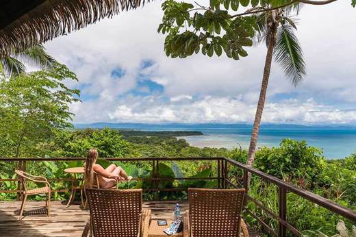 A peaceful retreat at Lapa Rios overlooks the lush Osa rainforest and sparkling Pacific horizon. 