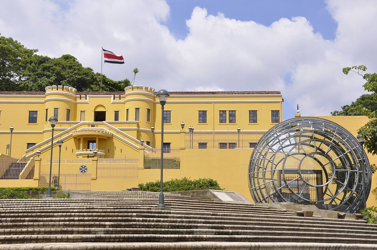 The striking yellow facade of the National Museum in San Jose, Costa Rica-an iconic landmark revealing the capital's cultural and historic charm. 