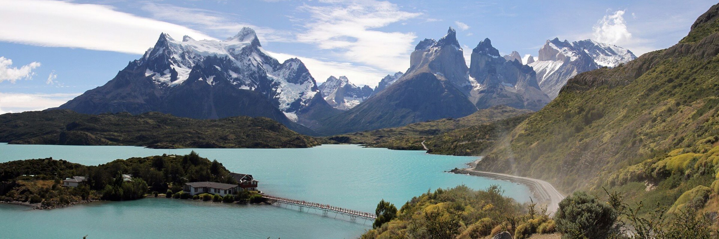 Turquoise lake with dramatic mountain peaks in Torres del Paine National Park, a scenic gem of Chilean Patagonia. 