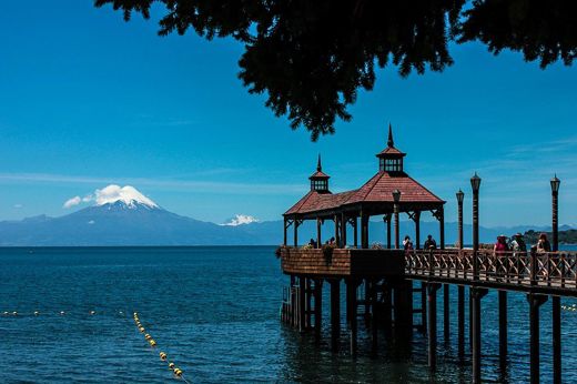 Pier over Lake Llanquihue with Osorno Volcano in the background near Puerto Varas, Chile. 