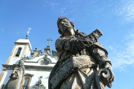 Stone prophet statue by Aleijadinho in front of the Basilica of Bom Jesus in  Congonhas, Minas Gerais, Brazil. 