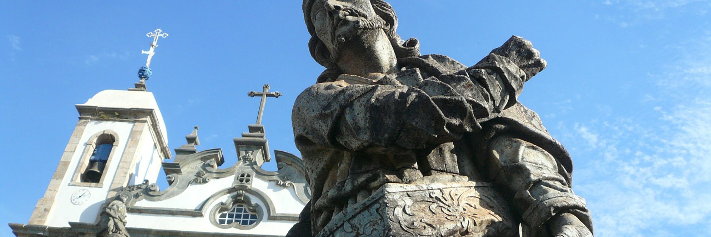 Stone prophet statue by Aleijadinho in front of the Basilica of Bom Jesus in  Congonhas, Minas Gerais, Brazil. 