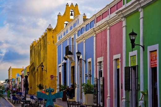 Colourful colonial street with pastel buildings and outdoor cafes in the historic center of Campeche, Mexico