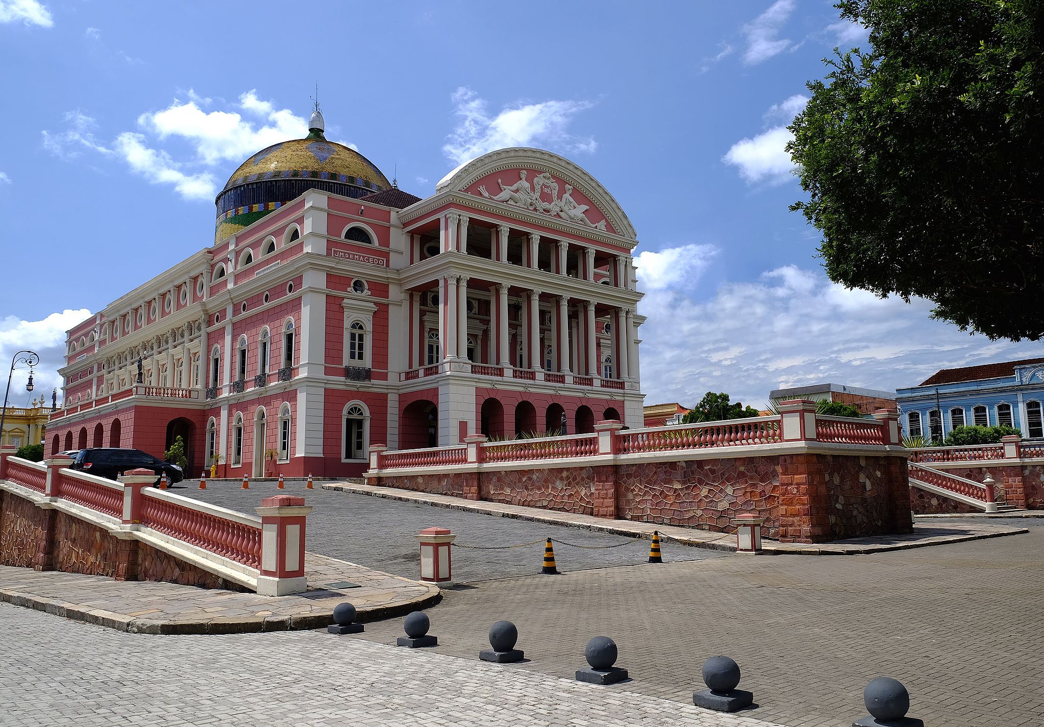 Teatro Amazonas in Manaus, a historic pink opera house with a golden dome in the heart of the Brazilian Amazon. 
