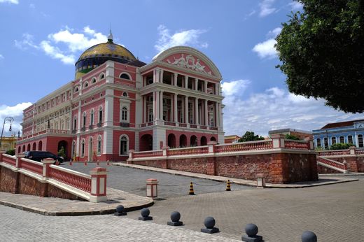 Teatro Amazonas in Manaus, a historic pink opera house with a golden dome in the heart of the Brazilian Amazon. 