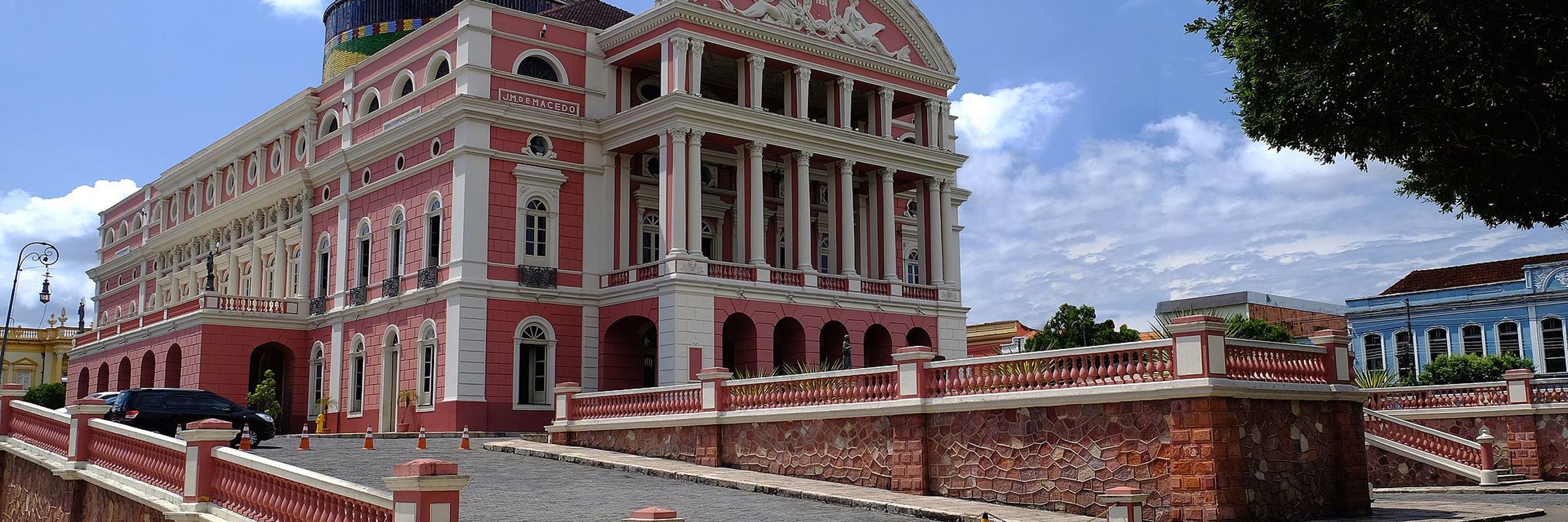 Teatro Amazonas in Manaus, a historic pink opera house with a golden dome in the heart of the Brazilian Amazon. 