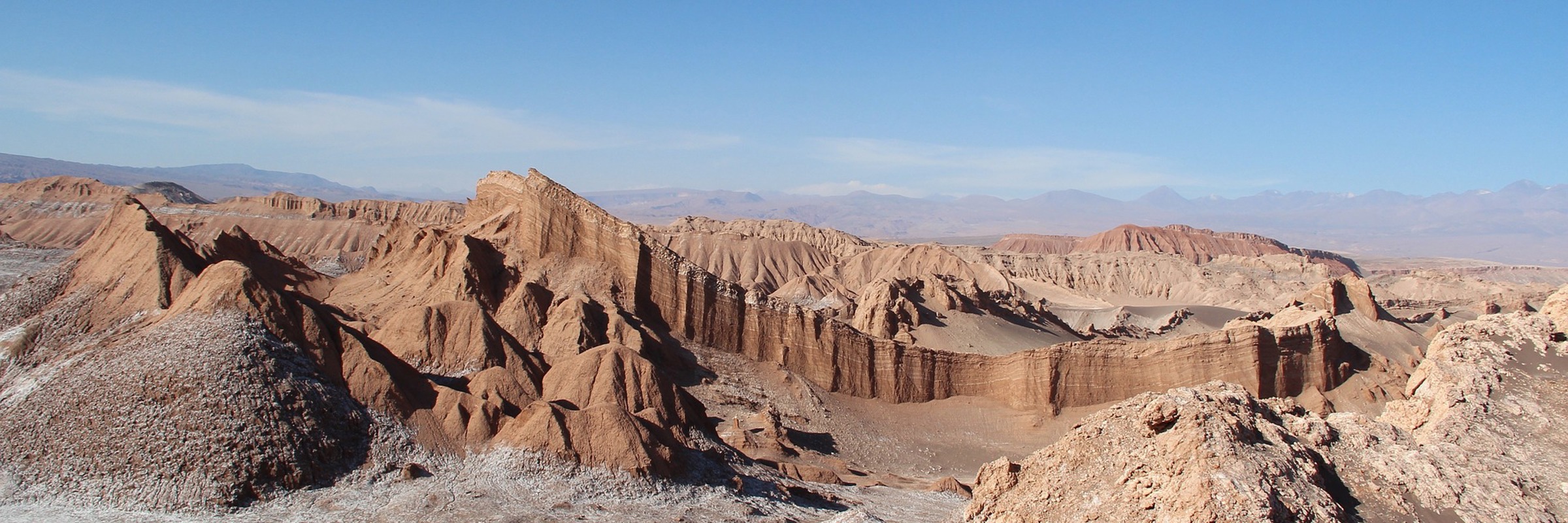 Craggy ochre ridges and salt-swept ground define the surreal terrain of Moon Valley in Chile's Atacama Desert. 