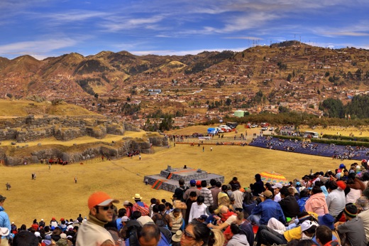 Crowds gather at Cusco's Sacsayhuaman fortress to witness the vibrant Inti Raymi festival. 