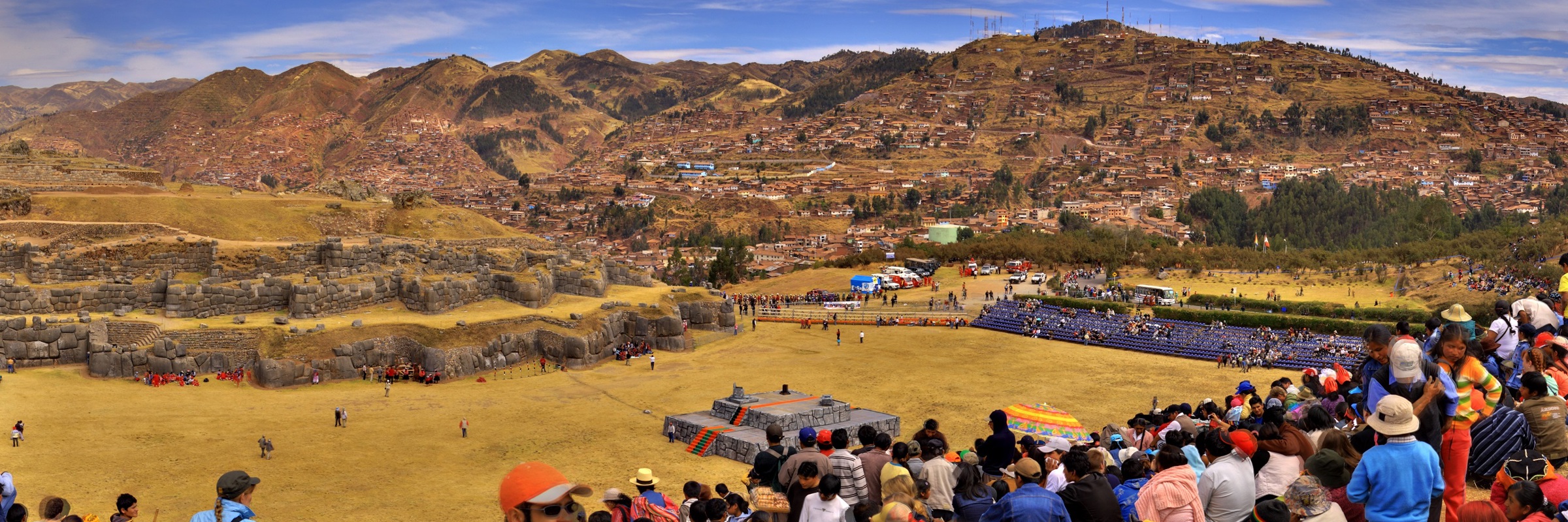 Crowds gather at Cusco's Sacsayhuaman fortress to witness the vibrant Inti Raymi festival. 