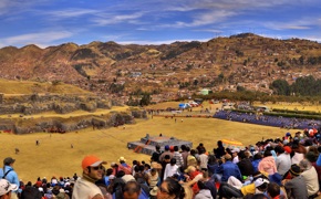Crowds gather at Cusco's Sacsayhuaman fortress to witness the vibrant Inti Raymi festival. 