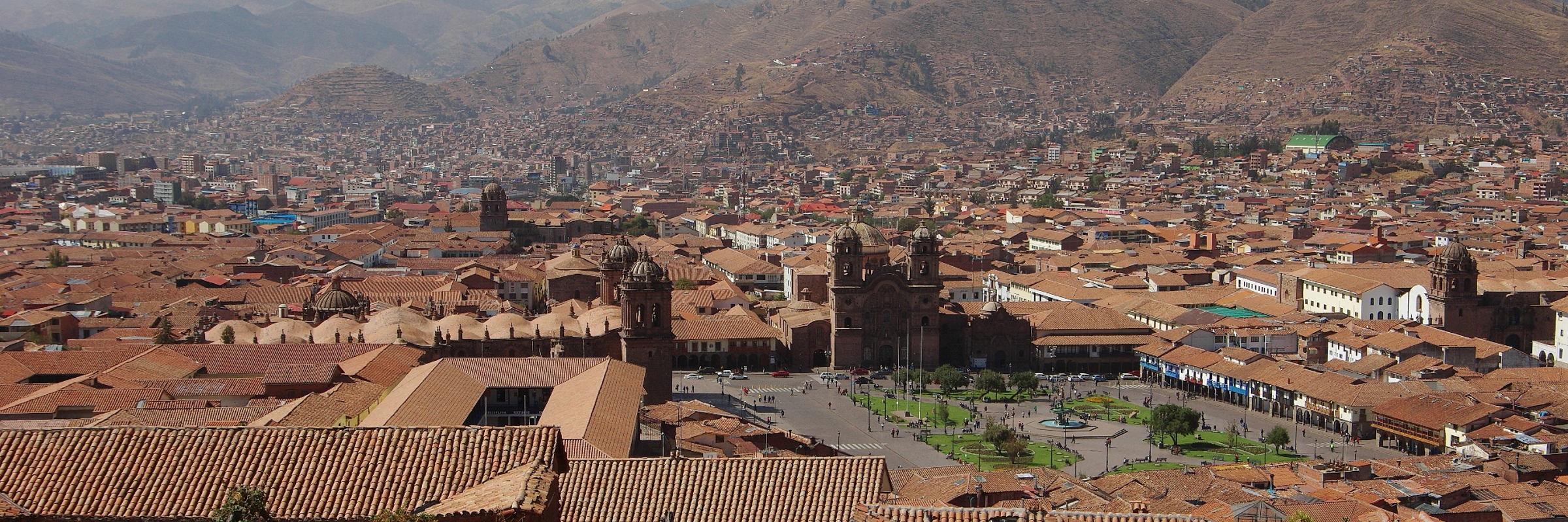 The rooftops of Cusco stretch beneath the Andes, echoing Inca and colonial legacy. 