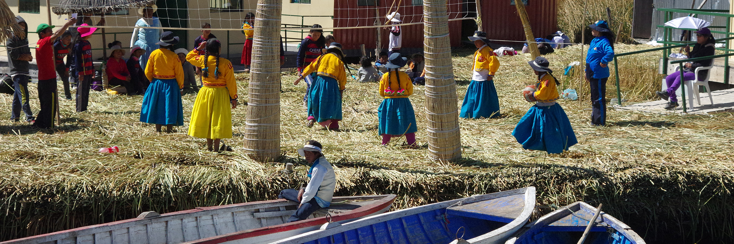 Traditional Uros islanders with reed homes and boats on Lake Titicaca in Peru. 