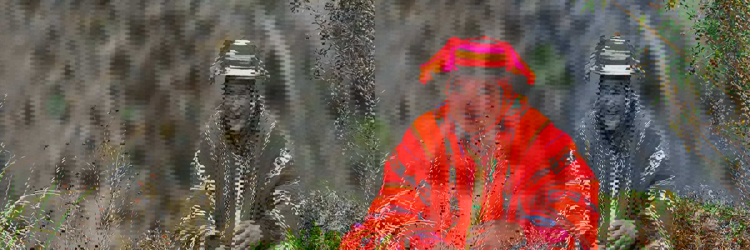 A local man in vibrant Andean dress plays a flute, embodying the spirit and culture of Peru's Sacred Valley. 