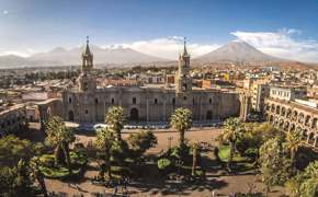Arequipa's Plaza de Armas and Cathedral with El Misti volcano in the distance.