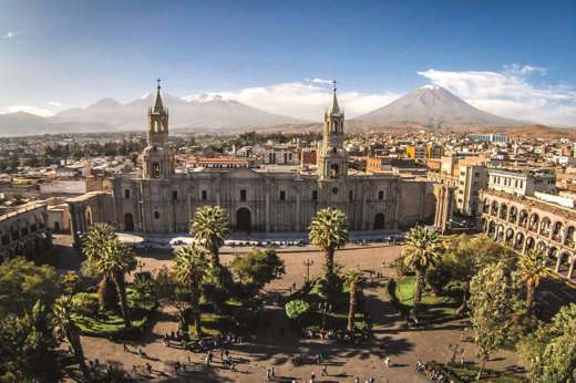 Arequipa's Plaza de Armas and Cathedral with El Misti volcano in the distance.