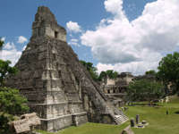 Tikal pyramid raising above the tree canopy