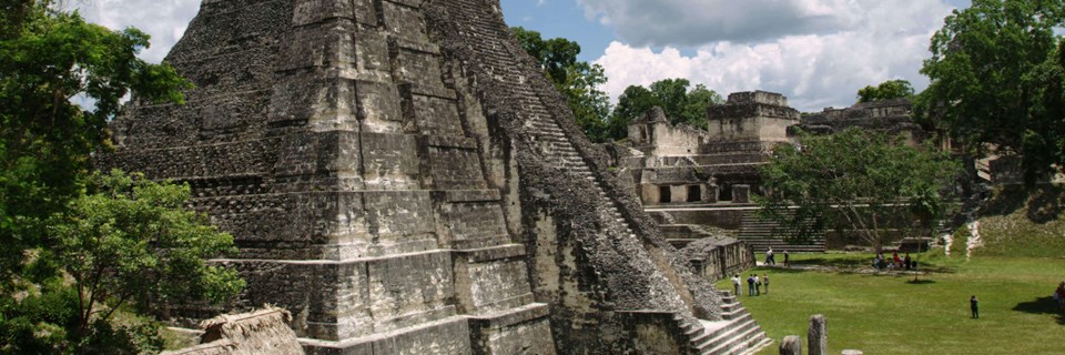 Tikal pyramid raising above the tree canopy