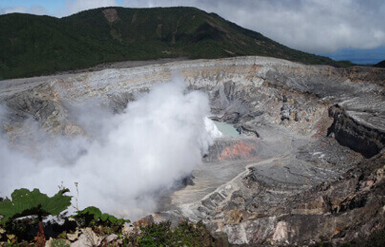 Steam rises from the dramatic crater of Poas Volcano, a powerful natural wonder in Costa Rica. 