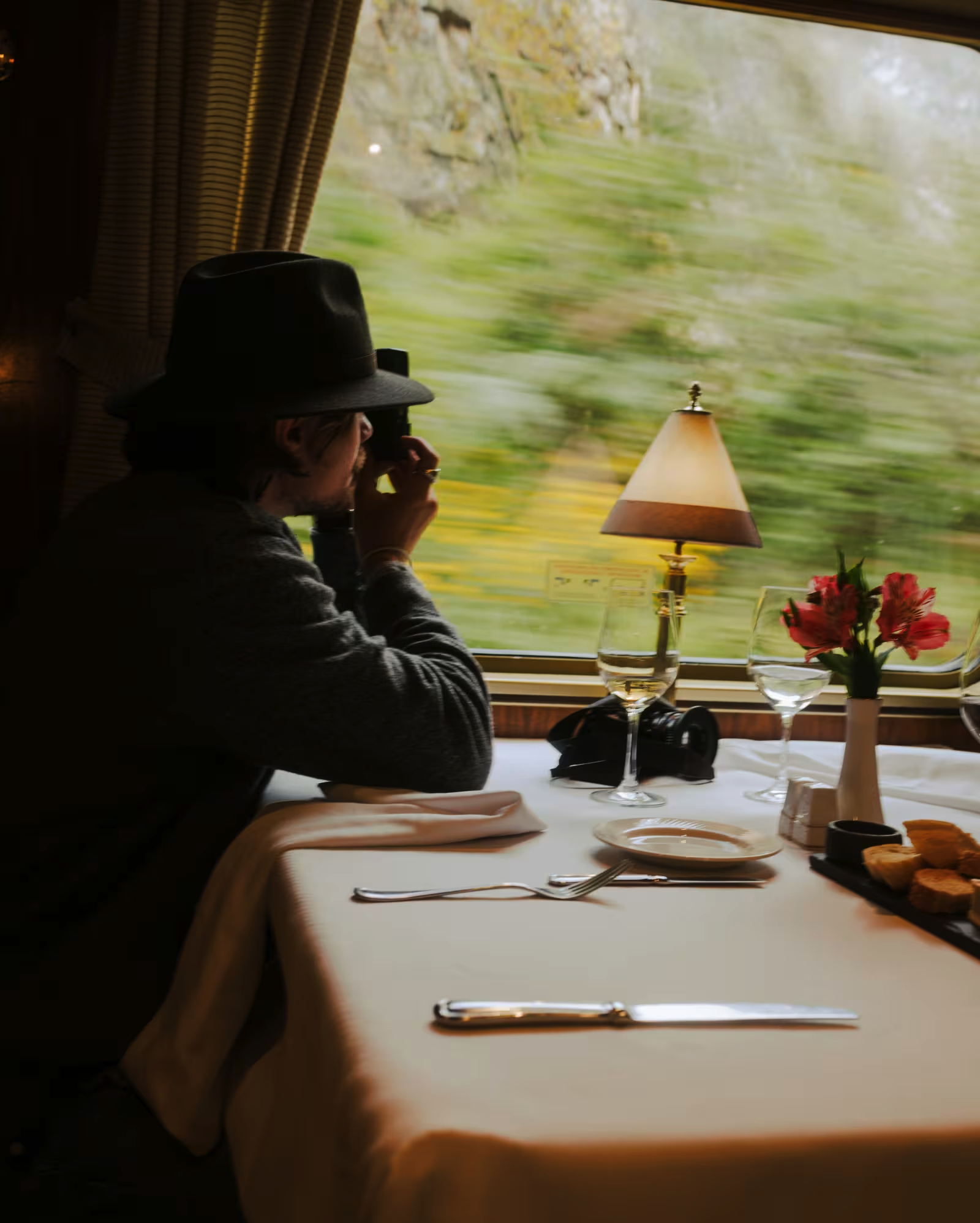 Passenger enjoying scenic views from the dining car on the Hiram Bingham train. 