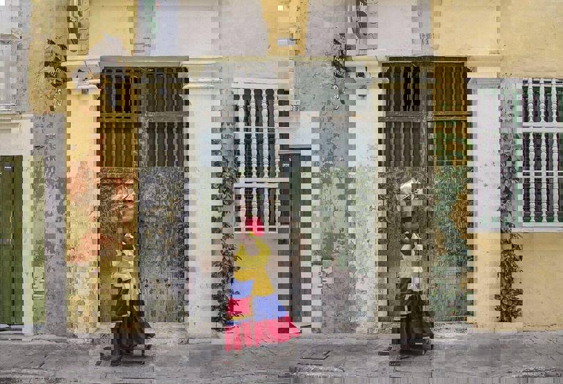 where to visit in Colombia - woman in Cartagena