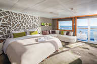 A stunning balcony suite with floor to ceiling windows