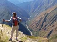 Hiker on the Inca overlooking Andes mountains near Machu Picchu, Peru adventure trek. 