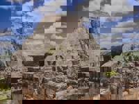 Pyramid of the Magician at Uxmal, a UNESCO World Heritage Mayan site with dramatic architecture in Yucatan, Mexico. 