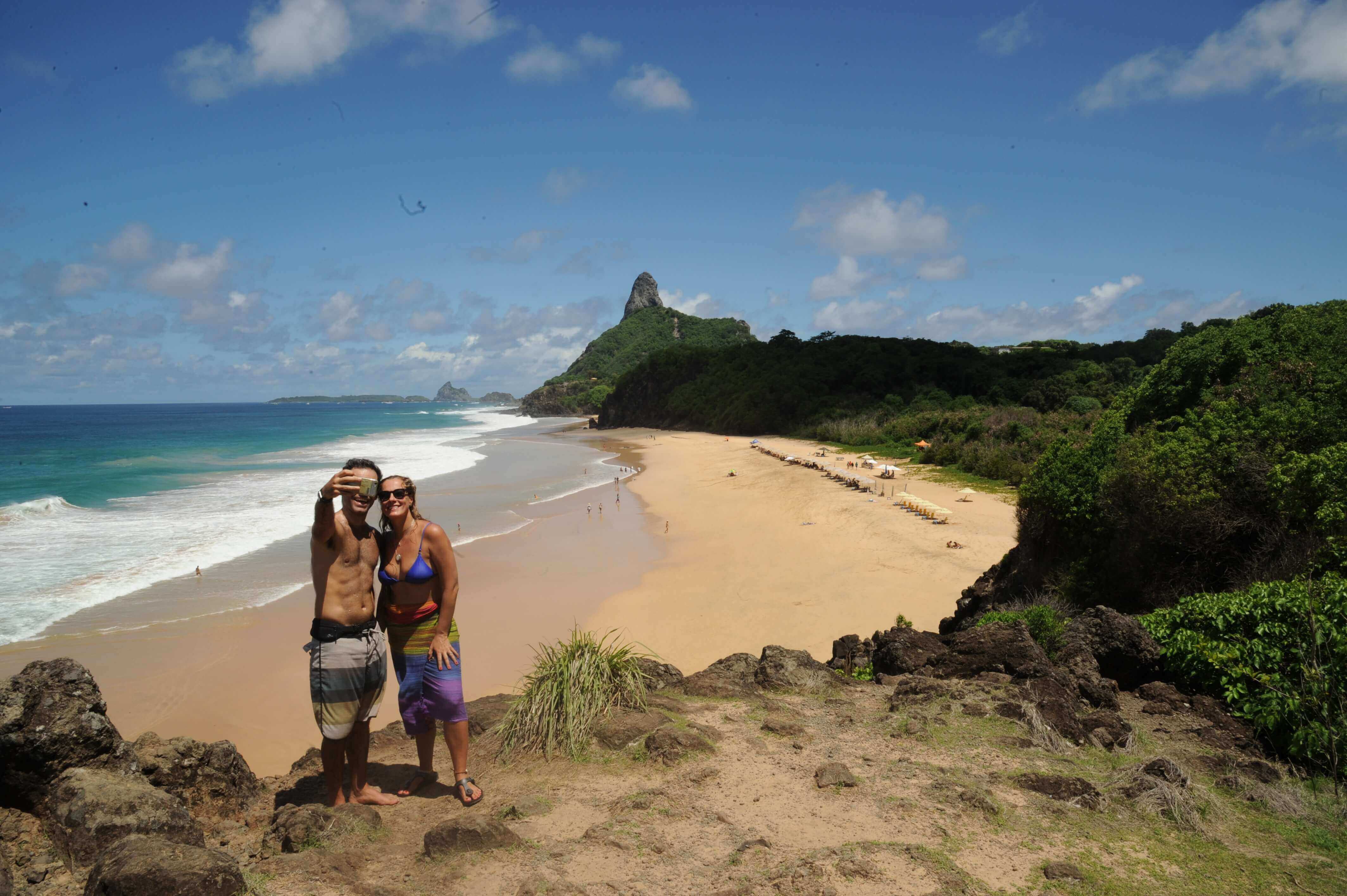 Dramatic beach and cliff views at Fernando de Noronha, Brazil's island escape. 