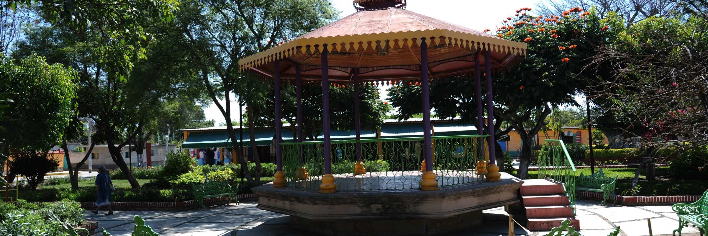 Charming bandstand in San Miguel de Allende's garden plaza, surrounded by greenery and colonial ambiance. 