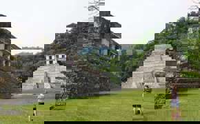Ancient Mayan ruins at Palenque, Chiapas, Mexico, with the Temple of the Inscriptions and surrounding jungle backdrop. 