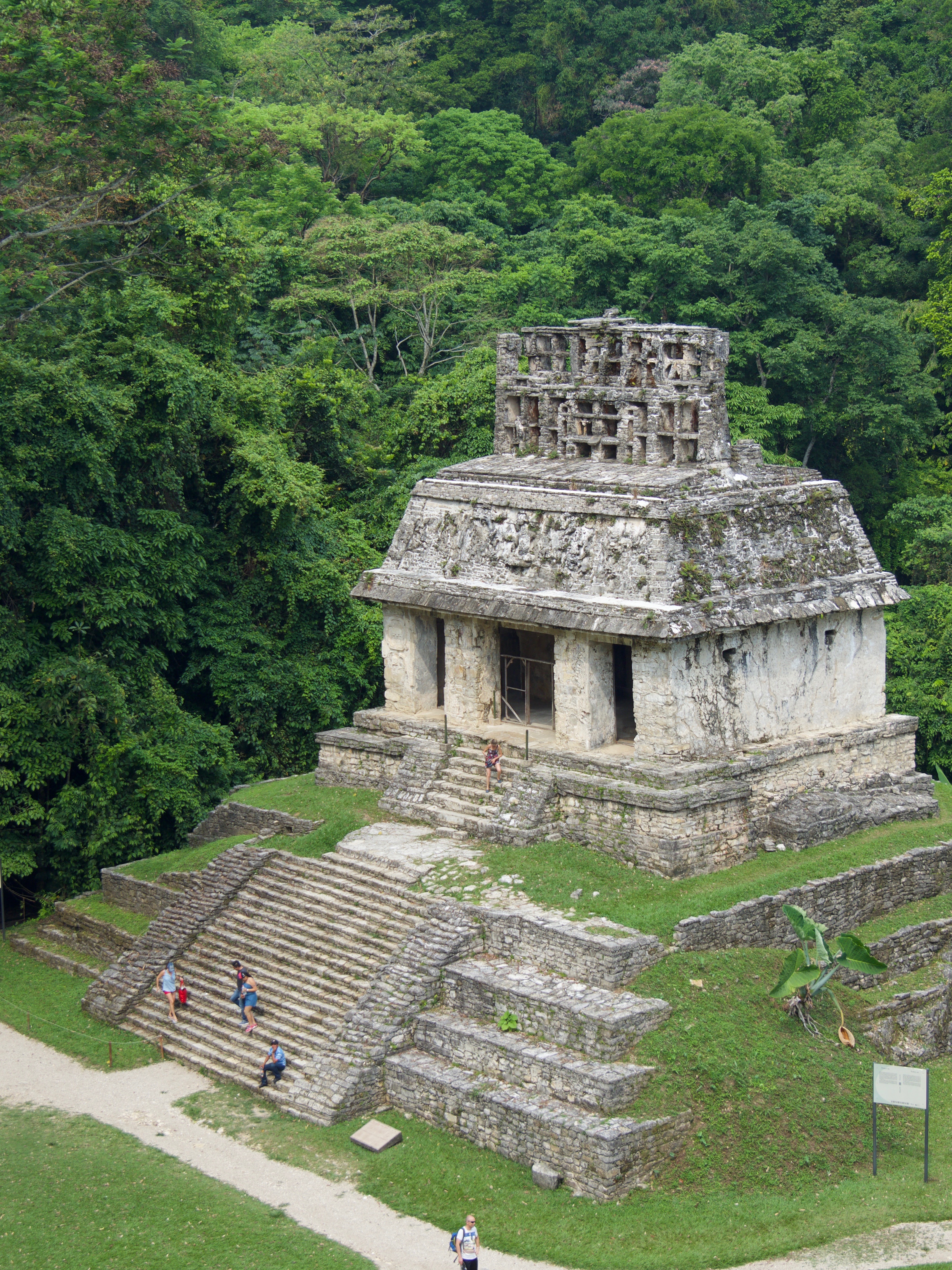 The Temple of the Sun at Palenque, Chiapas, Mexico showcasing Mayan architecture with intricate stone carvings and jungle backdrop. 