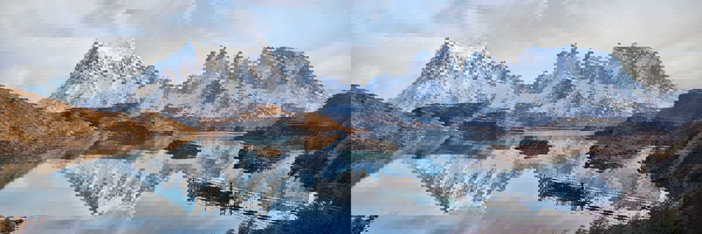 Cyrstal-clear Pehoe Lake reflects the jagged peaks of Torres del Paine, Chile. 
