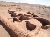 Ancient archaeological ruins in the Atacama Desert, showcasing early adobe structures and dry desert terrain. 