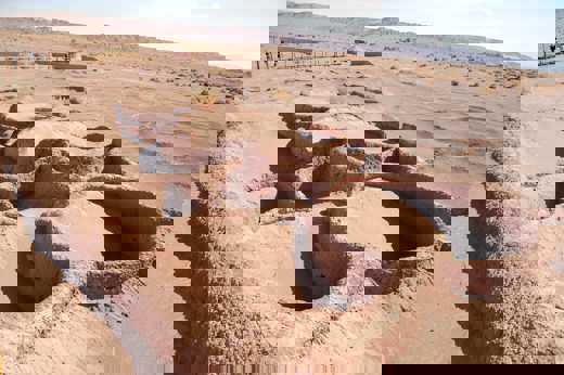Ancient archaeological ruins in the Atacama Desert, showcasing early adobe structures and dry desert terrain. 