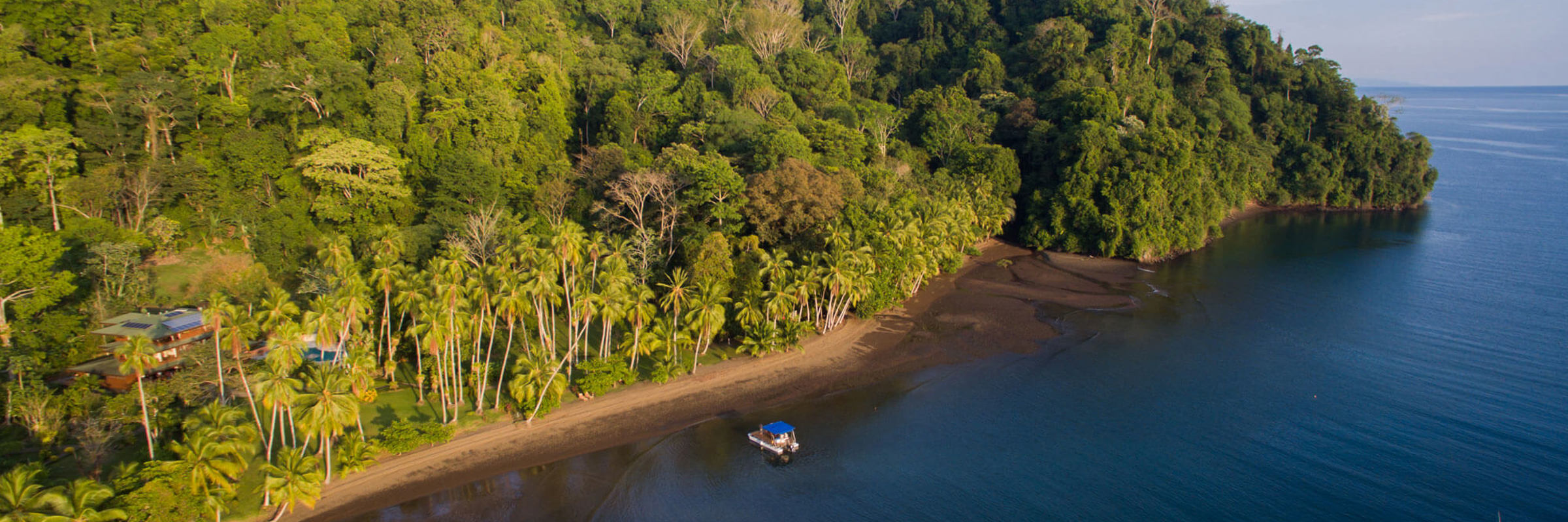 Lush rainforest meets serene ocean waters at Cativo Lodge on Costa Rica's remote Golfo Dulce. 