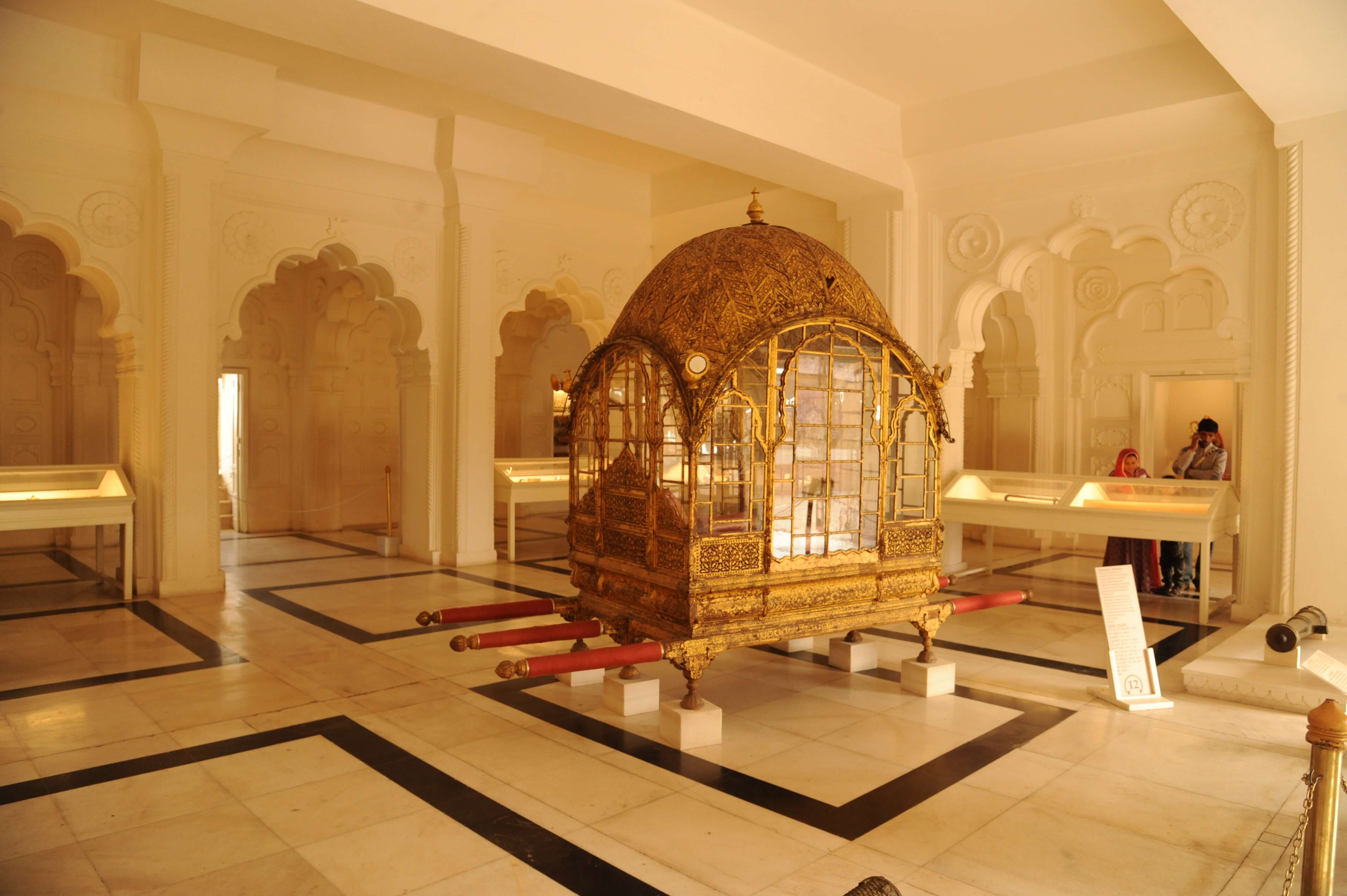 Asia, India - Ornate golden palanquin displayed in the City Palace Museum, Rajasthan. 